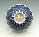 Blue and white porcelain bowl with vegetal motif, bottom view.