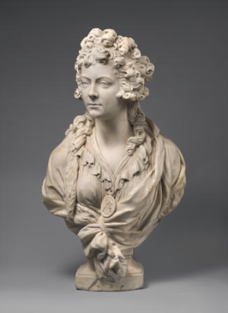 A marble sculpture bust of a lady, perhaps Mrs. Mary Robinson.  She has long curly hair, that i…