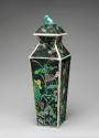 Alternate view of porcelain square covered vase with black ground and floral and vegetal design…
