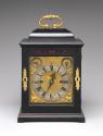Front view of Bracket Clock with gilt bronze elements such as the handle, keyhole and decorativ…
