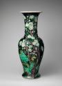 Alternate view of black ground porcelain vase with branches, leaves, rocks, and yellow and whit…