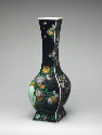 Porcelain quadrilateral vase with bloack ground and floral and vegetal designs