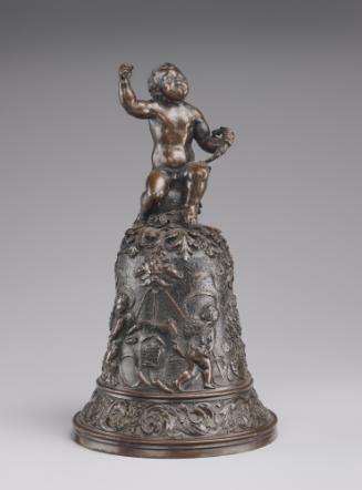 A bronze hand bell. The body of the hand bell is decorated with lively motifs, including pairs …