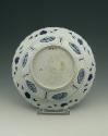 Blue and white porcelain deep plate with two figures in a landscape, view of bottom.