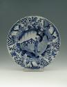 Blue and white porcelain deep plate with two figures in a landscape.