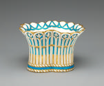 Alternate view of porcelain basket-shaped dish in blue, white, and gold