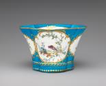 Alternate view of porcelain four-lobed dish in blue, white, and gold with birds