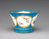 Alternate view of porcelain four-lobed dish in blue, white, and gold with birds
