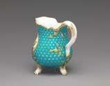 Alternate view of porcelain milk jug in blue and gold with image of bird in water