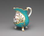 Alternate view of porcelain milk jug in blue and gold with image of bird in water