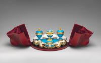 Porcelain inkstand in blue and gold in open red case