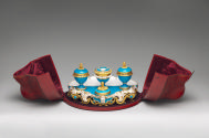 Alternate view of porcelain inkstand in blue and gold in open red case