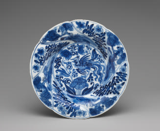 Blue and white porcelain shallow plate with bird and plant motifs