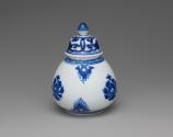 Alternate view of blue and white porcelain covered jar with plant design