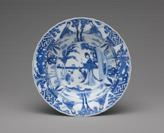 Blue and white deep porcelain plate with standing woman and ornate design