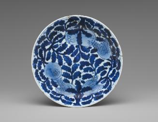 Blue and white porcelain deep plate with vegetal decoration