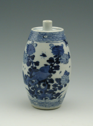 Blue and white porcelain candle taper, decorated in floral pattern.
