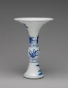 Alternate view of blue and white porcelain slender beaker with broad rim