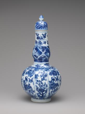 Blue and white porcelain bottle-shaped vase with vegetal decoration