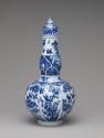 Alternate view of blue and white porcelain bottle-shaped vase with vegetal decoration