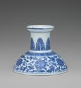 Alernate view of blue and white hard-paste porcelain low candlestick with blue foliage decorati…