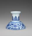 Blue and white hard-paste porcelain low candlestick with underglaze blue foliage decoration