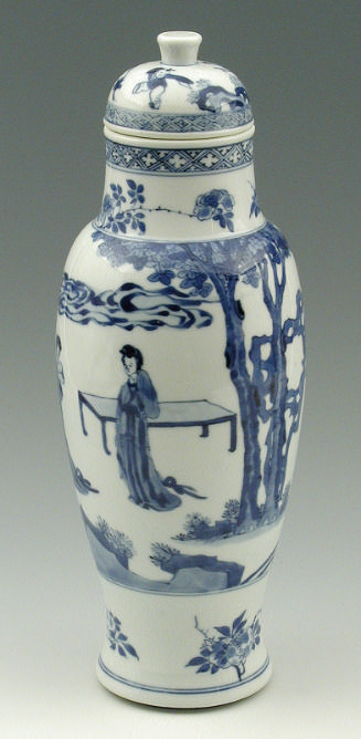 Blue and white porcelain covered jar with figures in a landcape. 
