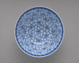 Interior view of white hard-paste porcelain bowl with everted lip with underglaze blue decorati…