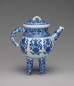 Alternate view of white hard-paste four-legged vessel with spout and handle and underglaze blue…