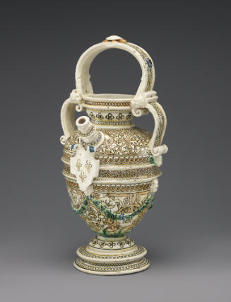 Painted porcelain ewer with spout at the center