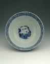 Blue and white porcelain bowl with robed figures, view of interior with figure and landscape.