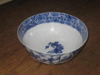 Blue and white porcelain bowl depicting figures in a landscape.