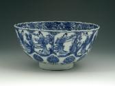 Blue and white porcelain beaker vase featuring figures in robes.