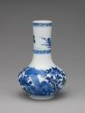 Blue and white porcelain bottle-shaped vase with vegetal decoration