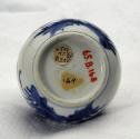 White hard-paste porcelain bottle-shaped vase with underglaze blue floral decoration, bottom vi…