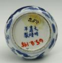 White hard-paste porcelain water receptacle with underglaze blue dragon decoration, bottom view