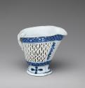 Side view of blue and white porcelain reticulated cream pot or libation cup