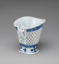 Back view of blue and white porcelain reticulated cream pot or libation cup