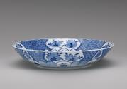 Alternate view of white hard-paste porcelain dish with foliate rim with underglaze blue decorat…