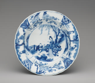 Blue and white porcelain plate with two figures at the center