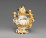 Back view of large anthropomorphic teapot with gold