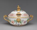 White porcelain lidded tureen with gilded handles decorated with garlands of flowers