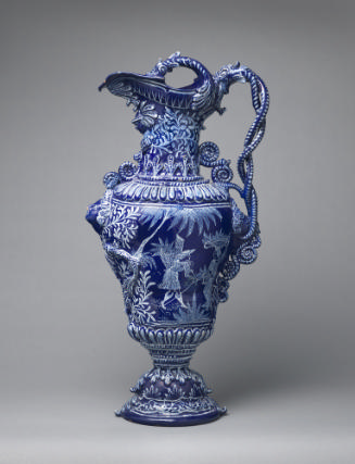Large deep blue ewer with ornate decoration and oriental figures