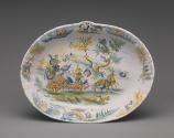 A large oval basin with a mythological scene, in color