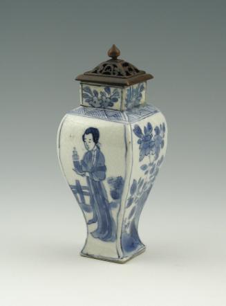 Blue and white porcelain vase with standing woman, square base, and metal lid