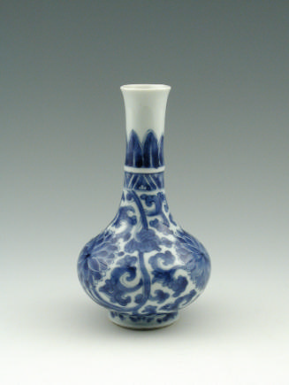 Blue and white porcelain vase with floral design and slender opening