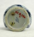 Bottom of blue and white porcelain jar with women and plant design