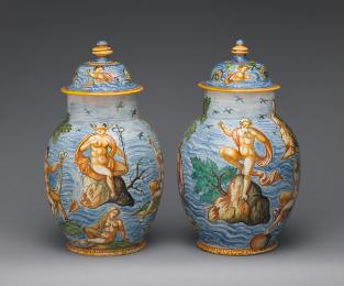 Two covered vases with figures in a seascape, in color
