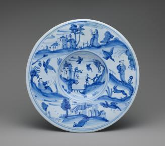 Circular plate with landscapes in blue and white