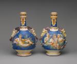 Alternate view of two flasks with ram heads and mythological scenes in a blue seascape